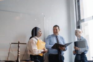 professional diverse colleagues talking about work in modern office