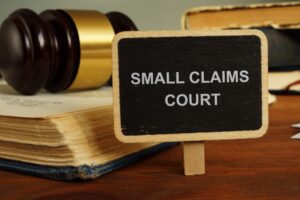 Text sign showing hand written words small claims court
