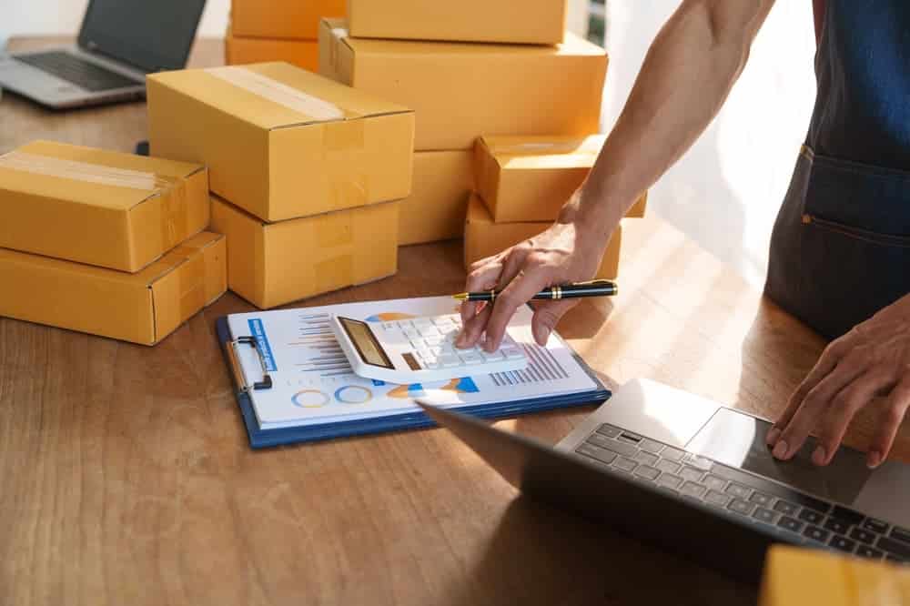 Thriving small businesses, home offices, manage packaging, shipping, client relations using laptop.