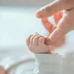 Close-up little hand of child baby holding