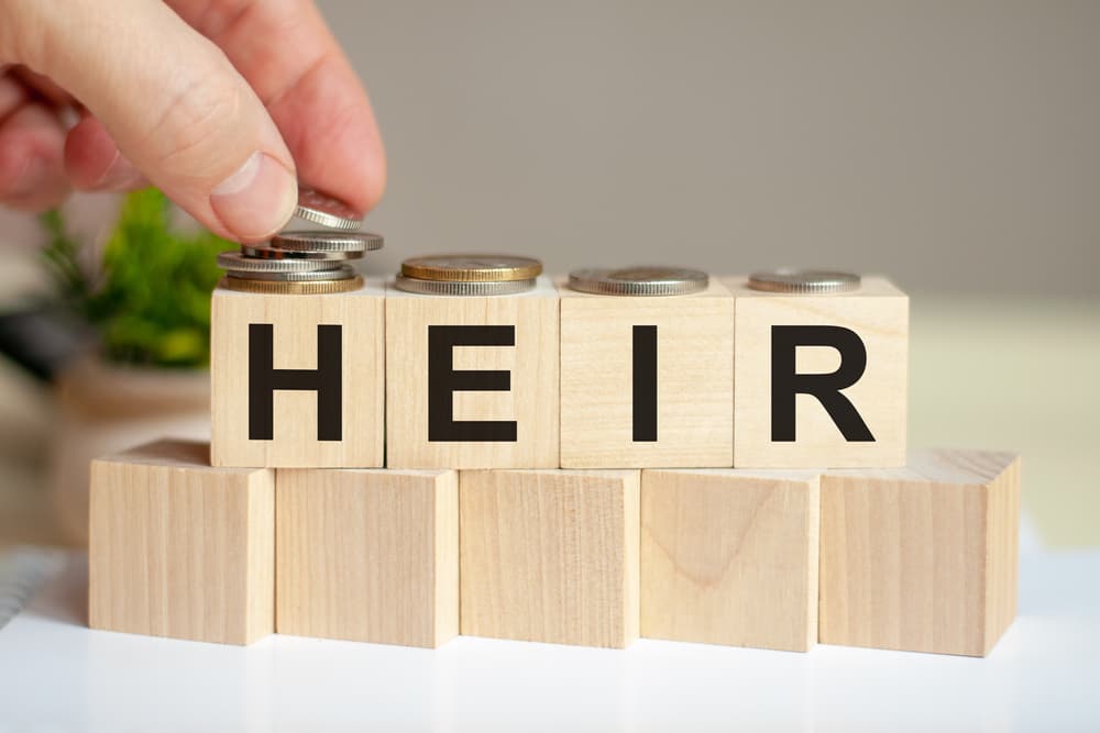 The word heir written on wood cubes.